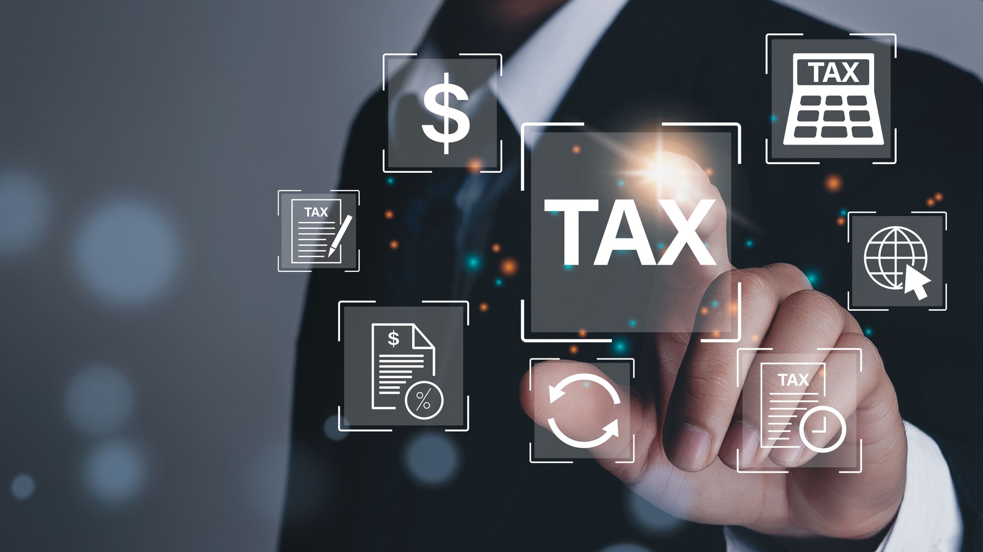 Business hand clicks virtual screen to tax return online for tax payment by corporations such as VAT, income tax, and property tax.